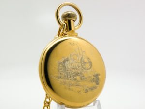 Westclox Pocket Watch The Conductor with Train Engraved on Back with Chain with Belt Hoop Clasp and Display Stand Included circa 1970s