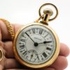 Westclox Pocket Watch The Conductor with Train Engraved on Back with Chain with Belt Hoop Clasp and Display Stand Included circa 1970s