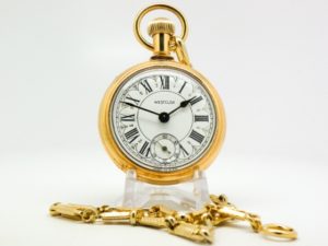 Westclox Pocket Watch the Conductor with Train Engraved on Back and Original Chain with Display Stand Included circa 1970s