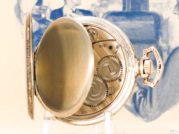 Hamilton dress pocket watch with case opened on a display stand